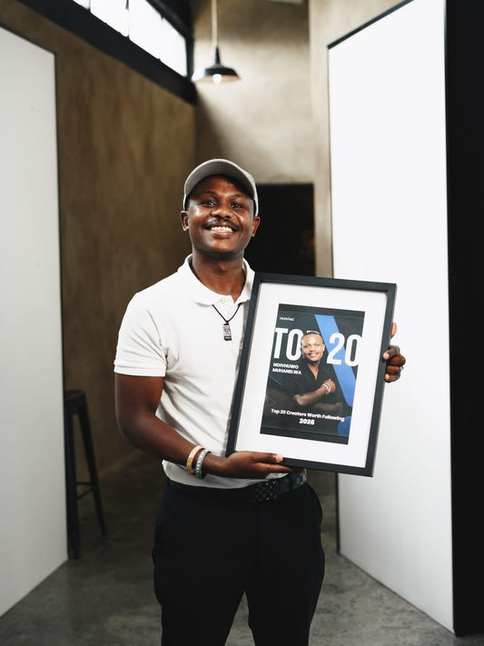 Ndivhuwo Muhanelwa holding Top 20 Creators award